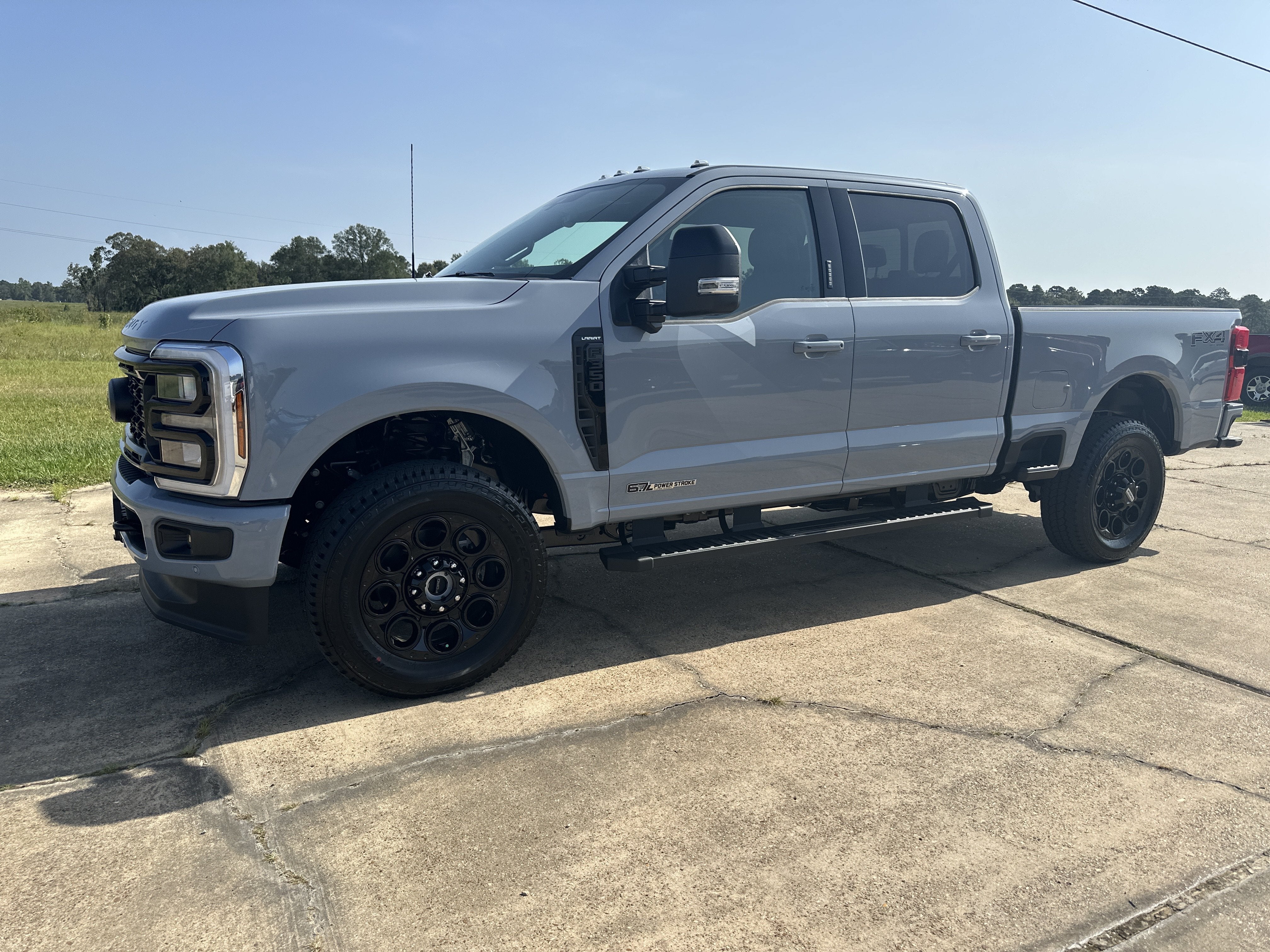 2026 Ford Super Duty F-350 Lariat in Glacier Gray Metallic Tri-Coat — front three-quarter view