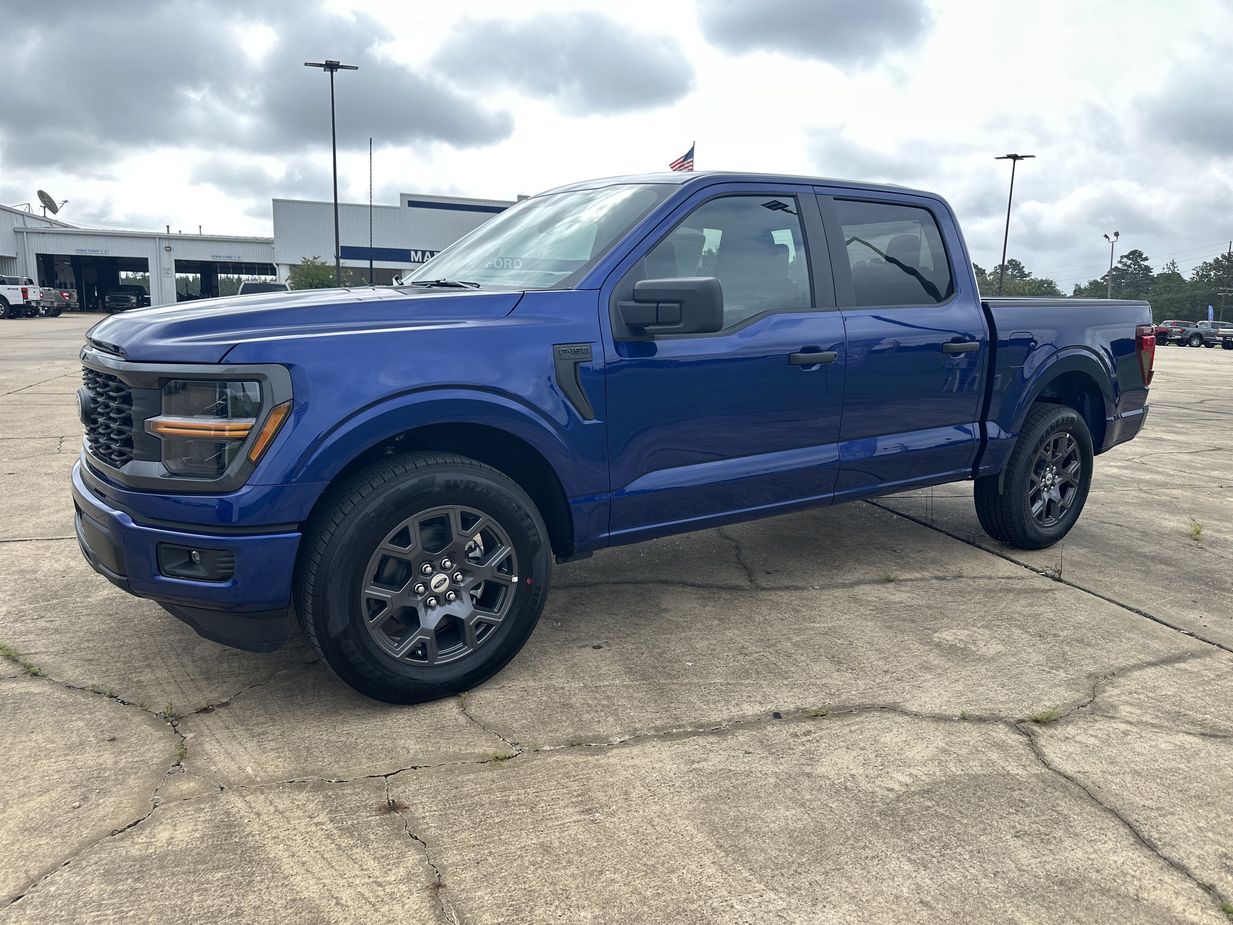 2026 Ford F-150 STX in Argon Blue Metallic — front three-quarter view