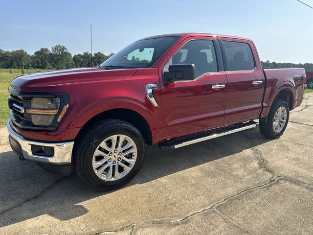 2026 Ford F-150 XLT in Ruby Red Metallic Tinted Clearcoat — front three-quarter view