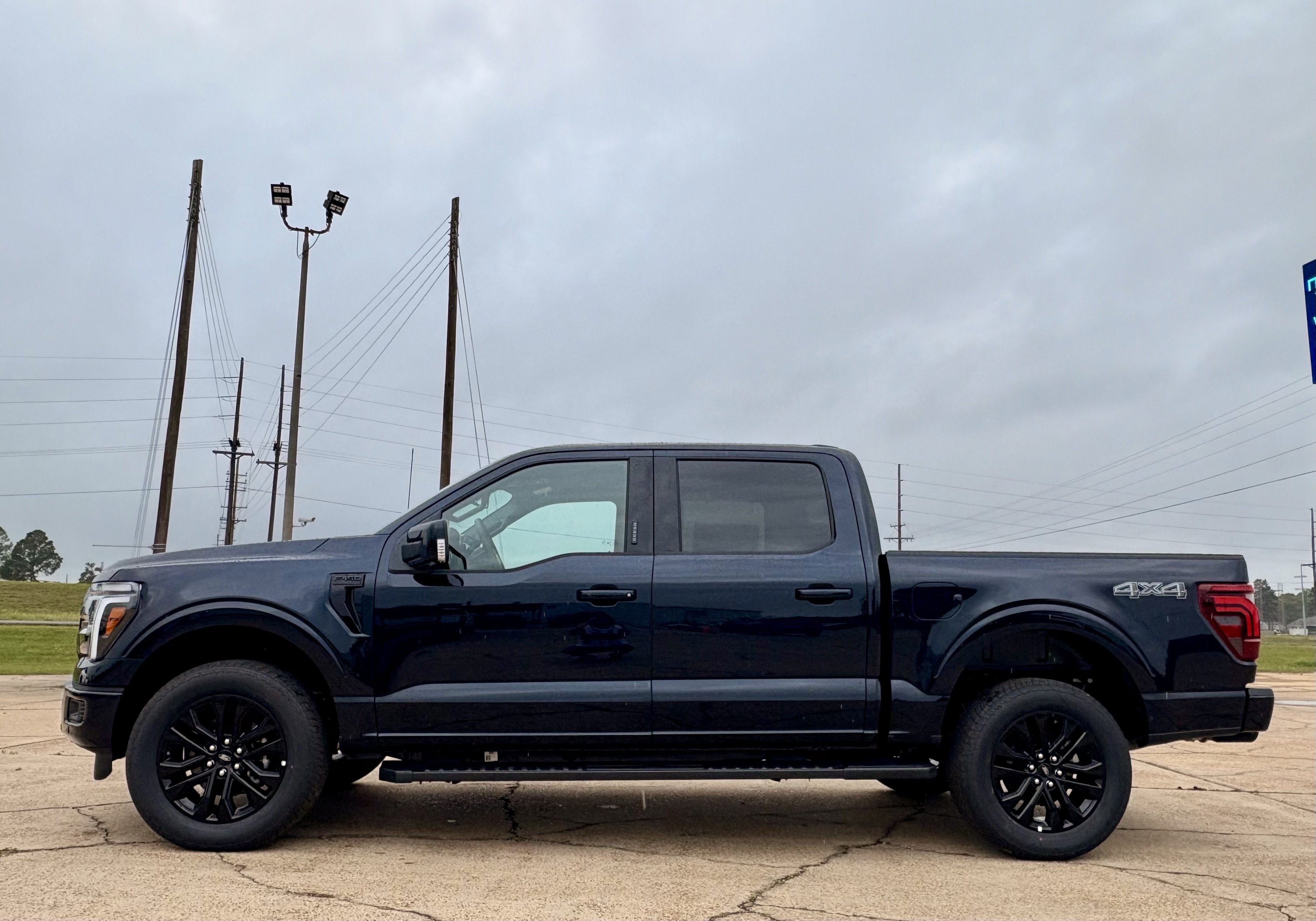 2026 Ford F-150 Lariat in Antimatter Blue Metallic — front three-quarter view