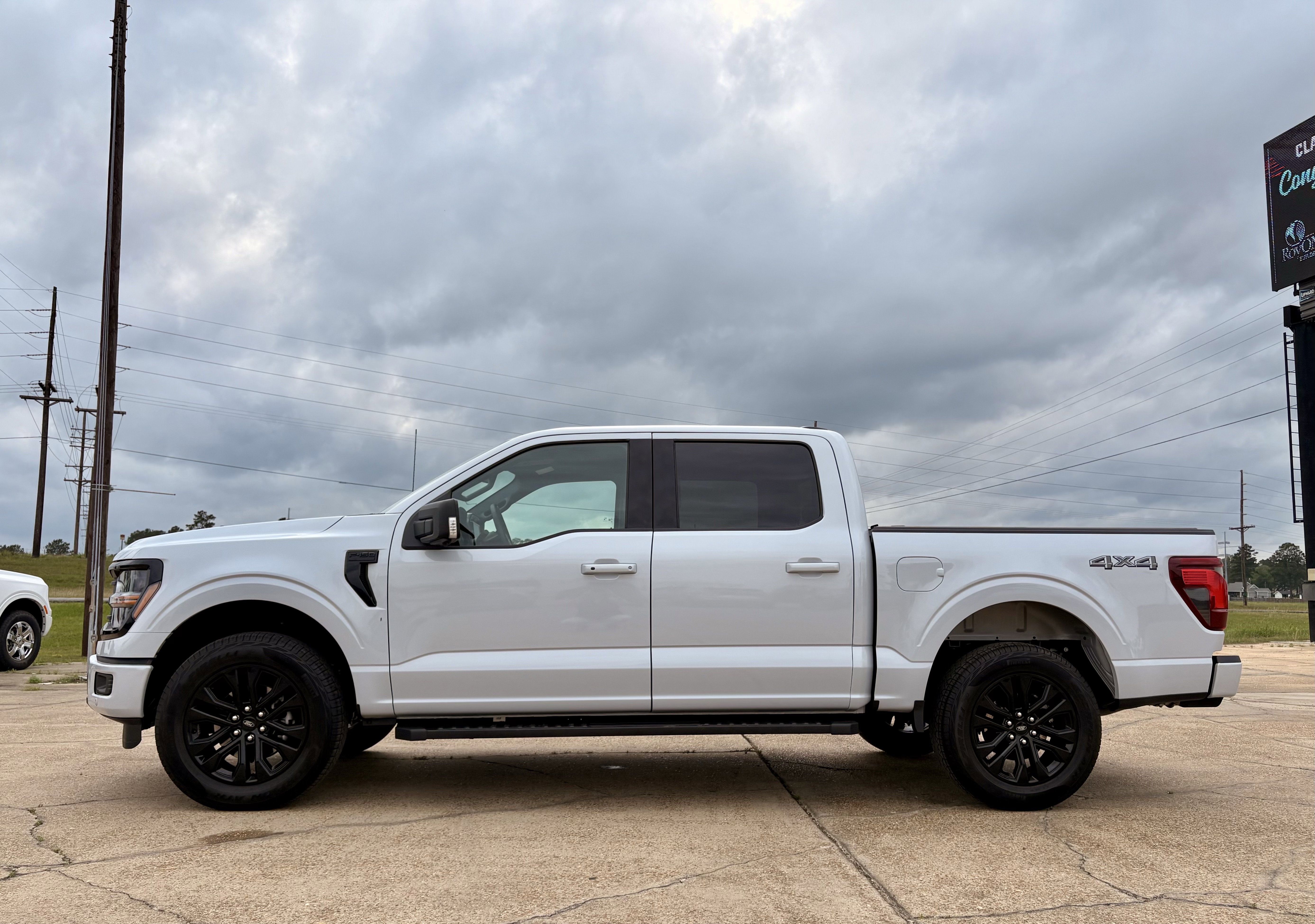 2025 Ford F-150 XLT in White — front three-quarter view